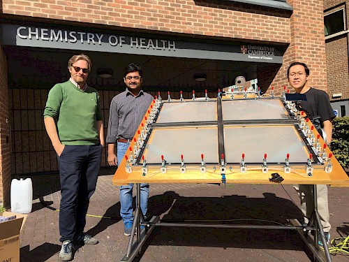 (Left to right) Erwin Reisner, Motiar Rahaman and Ariffin Bin Mohamad Annuar performing the 1 m2 photoreforming experiment outdoors beside the Yusuf Hamied Department of Chemistry, University of Cambridge. Credit: Yongpeng Liu
