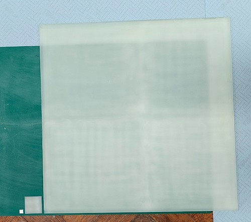 Photograph showing systematic scale up of photocatalyst sheets for photoreforming. (Left to right) 1 cm2 sheet for lab-scale optimisation, 20 cm2 sheet for scale up studies, 0.25 m2 panel for large-scale outdoor photoreforming demonstration. Credit: Ariffin Bin Mohamad Annuar